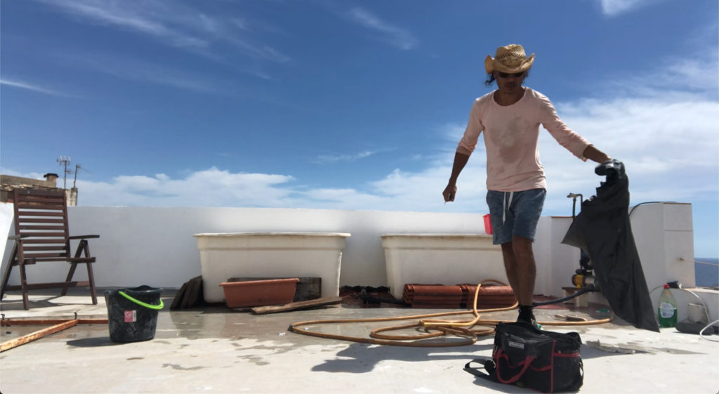 Handyman cleaning a terrace in an outdoor space, showcasing tips for maintaining a clean and inviting outdoor area."